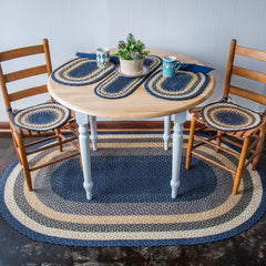 Primitive country style table setting with matching braided jute table accents, chair pads and rug
