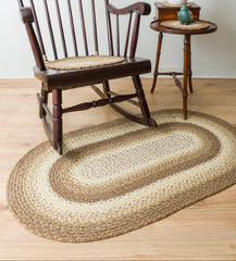 Oval braided jute rug in natural tans and white colors. 