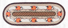 Decorative table runner with pumpkins and crows on a tan background made from braided jute.