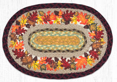 Oval braided placemat with autumn leaves design in orange, yellow, red and brown. Made from braided jute. 