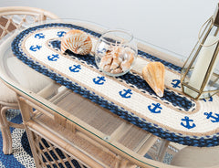 Nautical table runner with anchor design around border. 