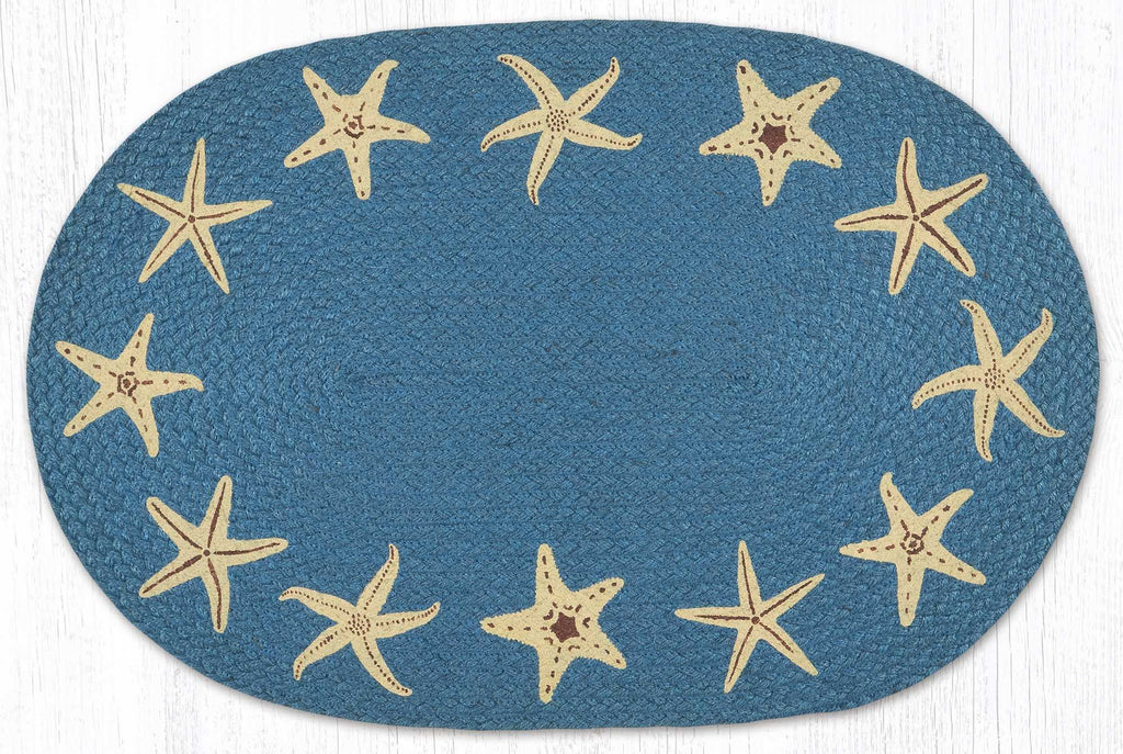 Blue oval rug with tan starfish designs for a beach house style or nautical decor